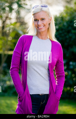 Portrait of a smiling mature woman outside Stock Photo - Alamy