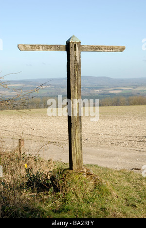 Old wooden footpath sign on top of Woolavington Down, on the South Downs Way, West Sussex, England Stock Photo