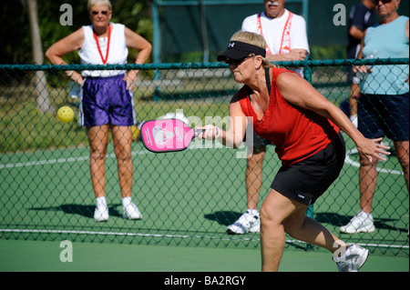 Senior citizens compete in game of Pickleball in the Senior state Olympics near Naples Florida Stock Photo