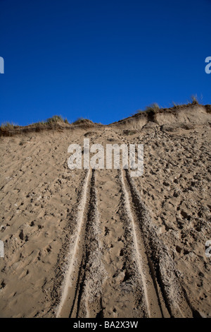 vehicle tracks in the sands dunes at Lagg on five finger strand on the inishowen peninsula county donegal republic of ireland Stock Photo