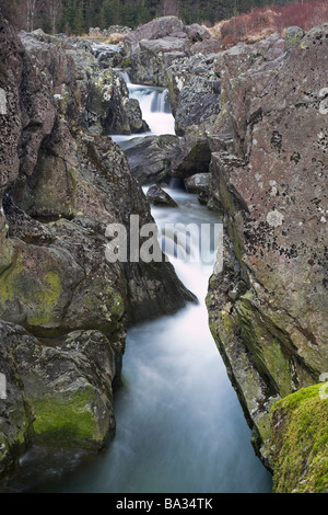 The River Duddon cascading through Birks Rapids above Birks Bridge in The Duddon Valley Dunnerdale Lake District Cumbria UK Stock Photo