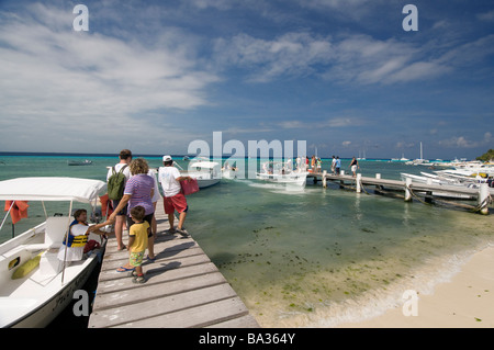 Tourists boarding boats for day trips to islands in Grand Roque Los Roques Venezuela South America Stock Photo