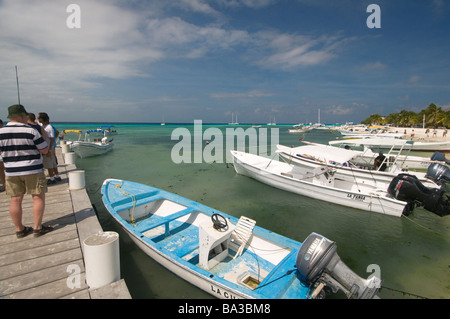 Tourists boarding boats for day trips to islands in Grand Roque Los Roques Venezuela South America Stock Photo