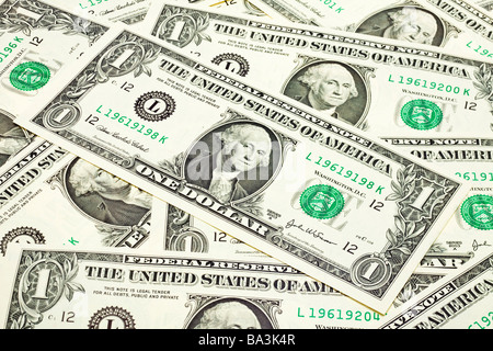 Group of US One Dollar bills laid flat close up Stock Photo