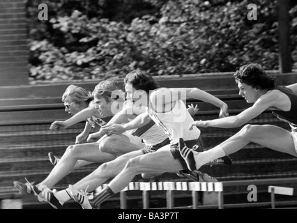 Seventies, black and white photo, sports, Athletics, district championships 1973 in the Jahn Stadium Bottrop, hurdling, men, D-Bottrop, Ruhr area, North Rhine-Westphalia Stock Photo