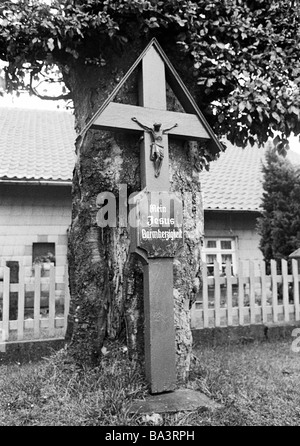 Seventies, black and white photo, religion, Christianity, wayside cross at a tree, Eifel near Monschau, North Rhine-Westphalia Stock Photo