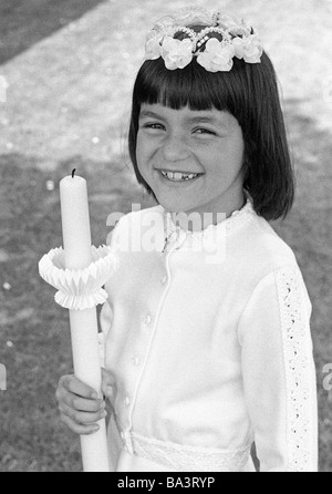 Seventies, black and white photo, religion, Christianity, First Communion, girl carries a candle, aged 8 to 12 years, Andrea Stock Photo
