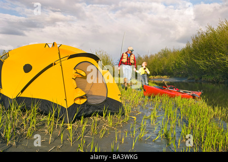 Father and son on a fishing and camping trip along Rabbit Slough in Southcentral Alaska during Summer Stock Photo