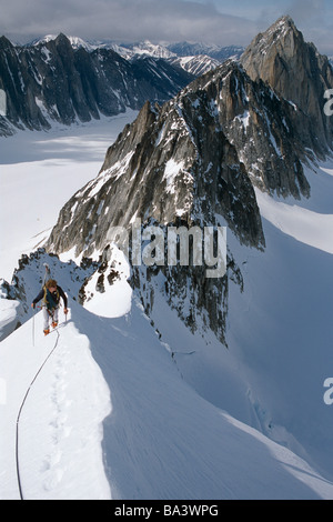 Narrow Ridge Path Mountaineer on a narrow ridge path, crossing the Hackenkoepfe, rocky ...