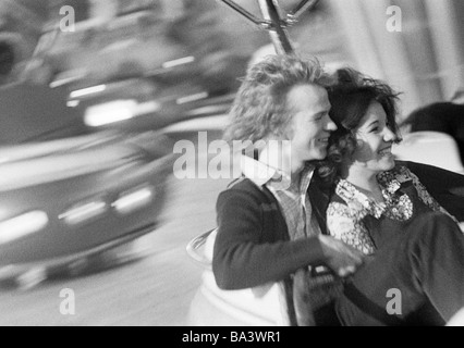 Seventies, black and white photo, people, young couple on a carousel on the kermess, aged 20 to 25 years, Crange Kermess, D-Herne, Ruhr area, North Rhine-Westphalia Stock Photo