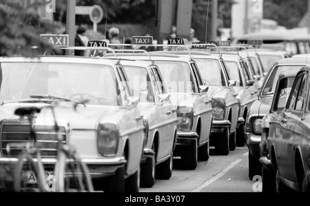 Seventies, black and white photo, road traffic, cab stand with many cabs Stock Photo