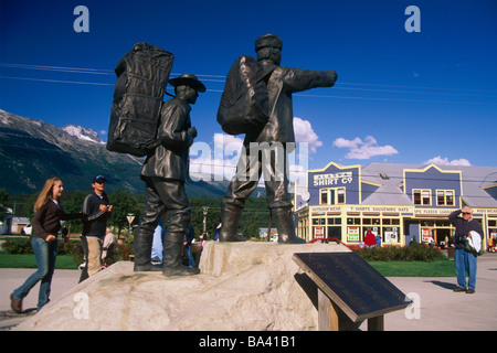 Visitors view Gold Rush monument in downtown Skagway Southeast Alaska Autumn Stock Photo