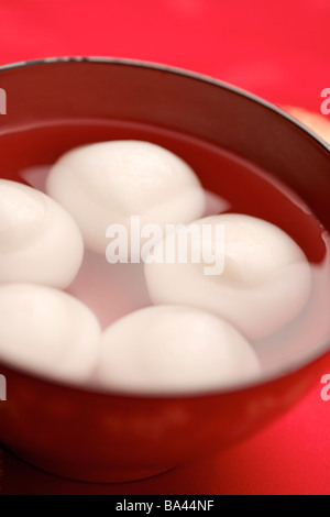 Bowl of dumplings dumplings made of sweet rice rolled into balls and stuffed with either sweet Stock Photo