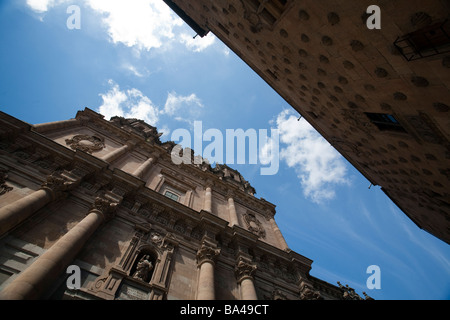 Low angle view of Clergy church left and the House of the Shells right town of Salamanca autonomous community of Castilla and Stock Photo