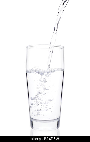 Water Pouring Into a Glass Stock Photo