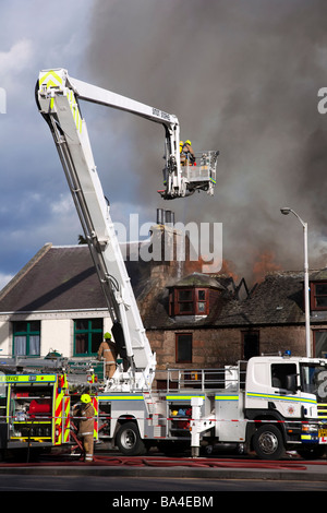 Firemen fighting Shop fire at George Strachan’s of Aboyne, Aberdeenshire, Scotland, UK, Europe, EU Stock Photo