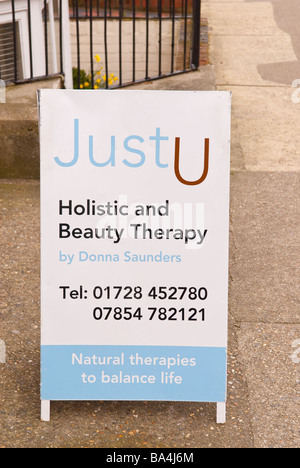 Justu holistic and beauty therapy sign outside a salon in Aldeburgh,Suffolk,Uk offering beauticians treatments Stock Photo