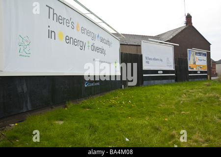 Advertising billboards for BP ING DIRECT and local house sales on hoardings in Newport South Wales UK Stock Photo