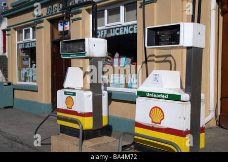 petrol gas pumps on the street outside mccleans combined bar shop petrol station in malin inishowen county donegal Stock Photo