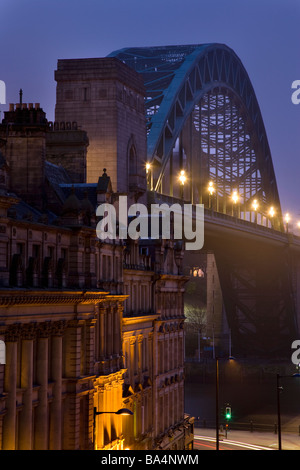 Tyne bridge and city street at night, Newcastle, Gateshead, England. Stock Photo