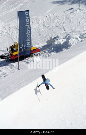 Snowboarder catching air at the half-pipe in Jakobshorn, Davos, Switzerland Stock Photo