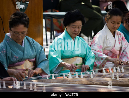 Japanese women playing Koto Stock Photo