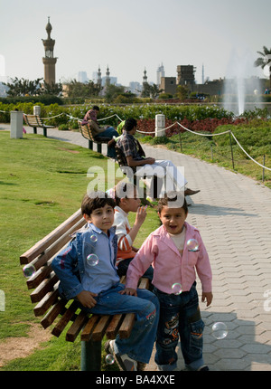 children blowing bubbles, al Azhar Park, Cairo, Egypt Stock Photo