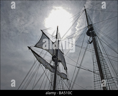 The masts of two tall ships against a clear blue sky. Mary Day and ...