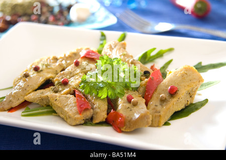 Veal escalopes cooked in vegetables and spices Stock Photo
