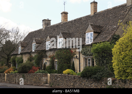 Terraced Row of stone cottages in Barnsley, The Cotswolds, Gloucestershire, England, UK Stock Photo