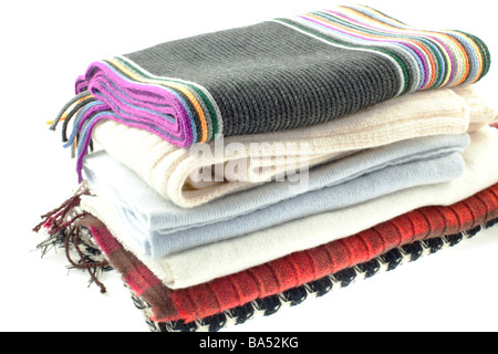 selection of six wool different scarves on a white background Stock Photo