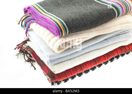 selection of six wool different scarves on a white background Stock Photo
