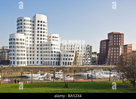 Neuer Zollhof buildings by Frank Owen Gehry and marina at Dusseldorf MediaHarbour Stock Photo