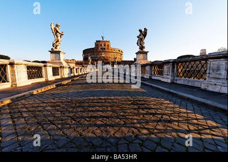 Looking across the Ponte Sant' Angelo towards Castel Sant' Angelo which was built on the  Mausoleum of the Emperor Hadrian Stock Photo