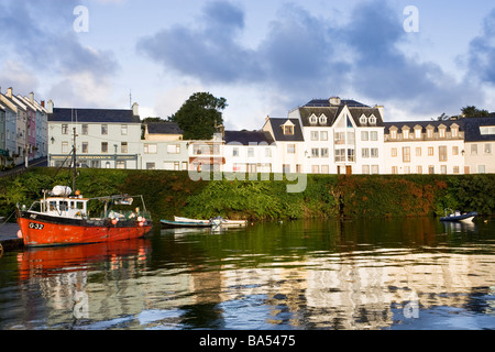 Fishing harbour at the Couty Galway village of Roundstone with a red trawler moored Stock Photo