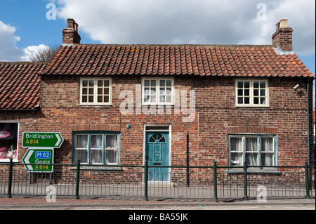 Old pantiled roofed village cottage fitted with modern security  camera Stock Photo