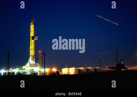 Illuminated drilling rig on public airport property at DFW international, airport Stock Photo