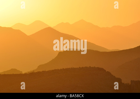 a glowing sunset over the superstition mountains and tonto national forest in arizona Stock Photo