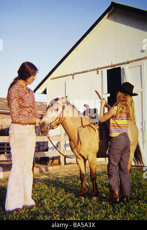Saddling A Pony Stock Photo