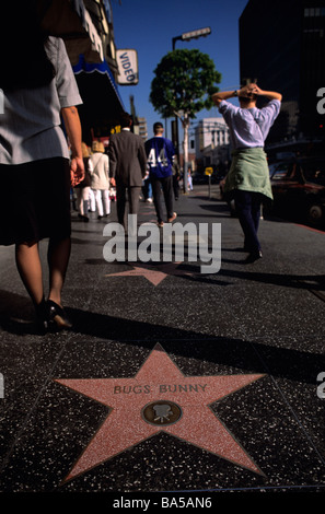 People walking along the Walk of Fame on Hollywood Blvd in Los Angeles ...