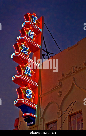 Texas Theater sign at dusk with glowing neon lights, the national landmark where Lee Harvey Oswald' was arrested as an assassin Stock Photo