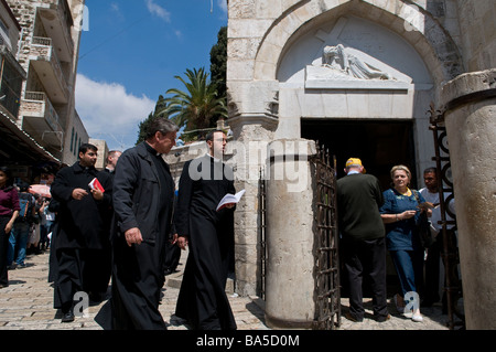 Christian clergymen pass 3rd Station of the cross in Via Dolorosa street during a Good Friday procession East Jerusalem Israel Stock Photo