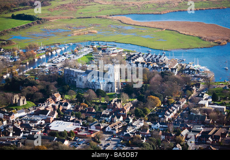Aerial view of Christchurch town, quay, priory, harbour, marshlands. Dorset. UK. Meeting of the Avon and Stour rivers. Stock Photo