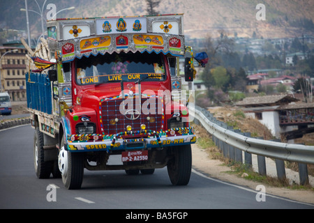 Colourful lorry transporting goods. Tata Bhutan Asia. Decorated in bright colours. Horizontal 90675 Bhutan Stock Photo