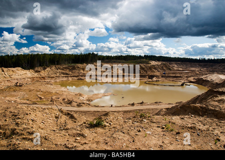 Panorama of big full of water sandpit. Stock Photo