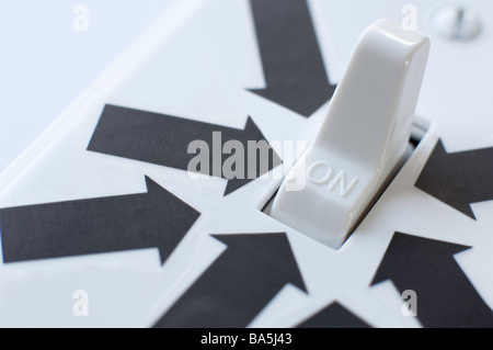 Black arrows all point to an electrical switch in the ON position Stock Photo