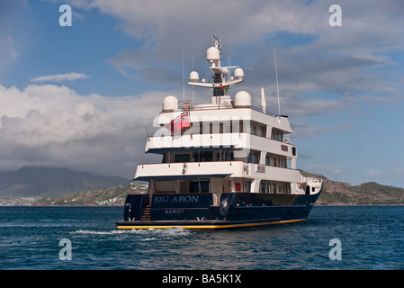 Superyacht 'Big Aron' underway off St Kitts from the stern quarter Stock Photo