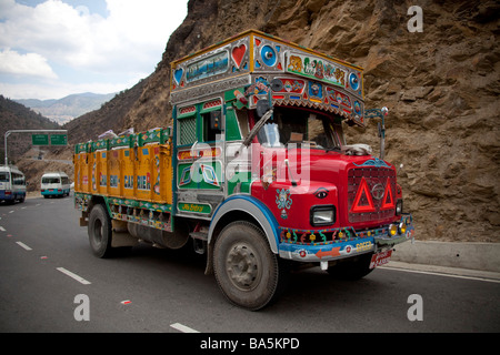 Colourful lorry transporting goods. Tata Bhutan Asia. Decorated in bright colours. Horizontal 90633 Bhutan Stock Photo