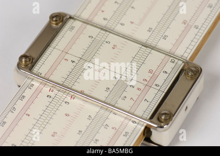 Detail of a slide rule scale and cursor of a slide rule. Stock Photo