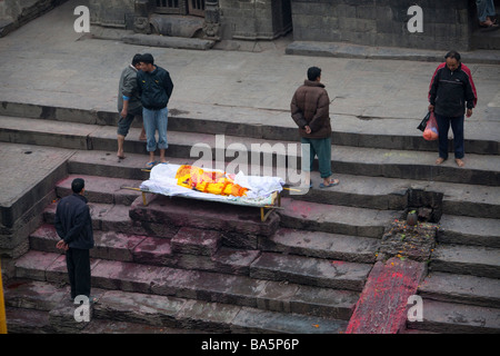 Human body ready to be burnt on cremation Ghats, Bagmati riverbank at Pashupatinath Nepal Asia. Horizontal 90513 Nepal Stock Photo
